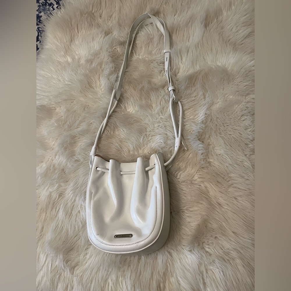 Rebecca Minkoff small, white Crossbody with tassel and adjustable shoulder strap